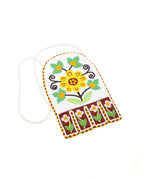 Floral octopus bag in caribou hide and glass beads – Attributed to Elizabeth Jacob, Webequie First Nation