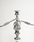 Paire de chandeliers anciens en métal argenté